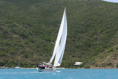 La Boheme sails near island shore