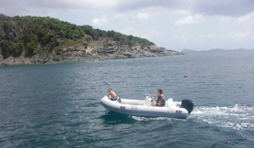 Young family heads to island shore